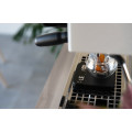 Acaia Lunar 2022 coffee scale with timer beside brewing equipment.