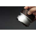 Barista using 58.5mm Airflow Coffee Distributor for perfect espresso.