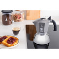 Bialetti 4 Cup Brikka Induction Coffee Maker on a kitchen table.