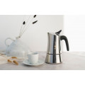 Bialetti Moon Exclusive Stainless Stove Top Coffee Maker: modern Italian craftsmanship next to a coffee cup.