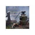 Bellman CX25S stove top coffee pot with steam wand next to a river.