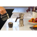 Modern 9Barista espresso machine showcasing premium stainless steel on a table.
